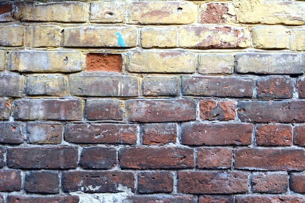 Gele bakstenen muur — Stockfoto