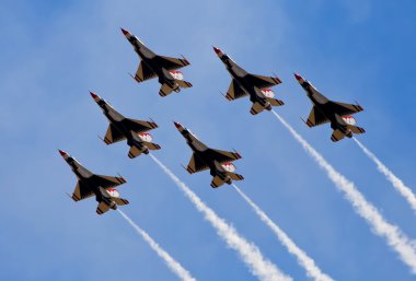 Smoke from army jets flying at airshow clipart