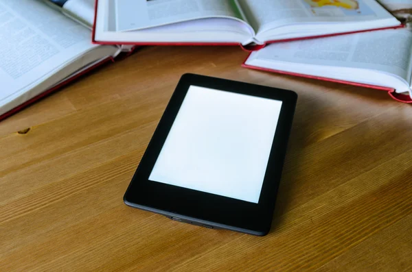 Lightweight e-book (electronic reader) compared to heavy thick b — Stock Photo, Image