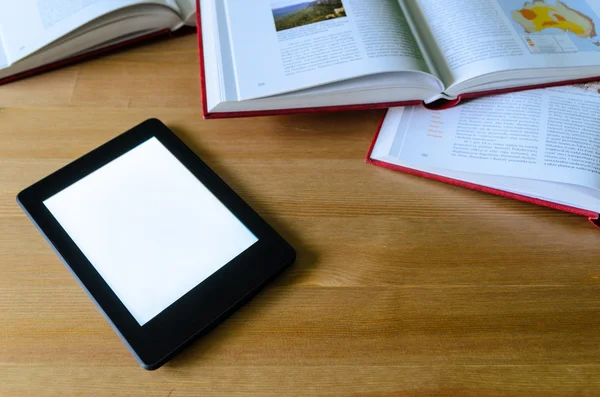 Lightweight e-book (electronic reader) compared to heavy thick b — Stock Photo, Image