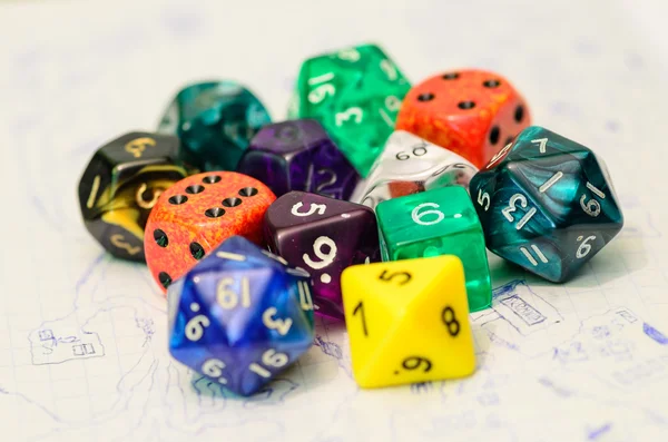 Role playing dices lying on sketch map — Stock Photo, Image