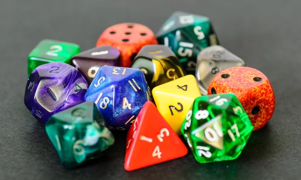 Role playing dices lying on black background — Stock Photo, Image