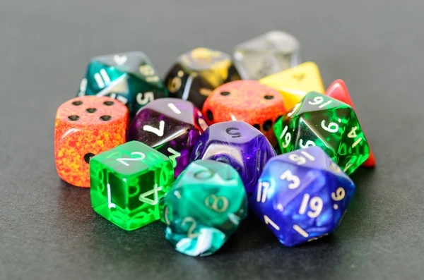 Role playing dices lying on black background — Stock Photo, Image