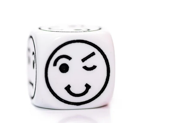 Single emoticon dice with blinking expression sketch — Stock Photo, Image