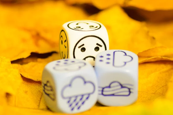 Depressing and sad weather of autumn shown on dice — Stock Photo, Image