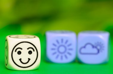 concept of good  summer weather - emoticon and weather dice on g clipart