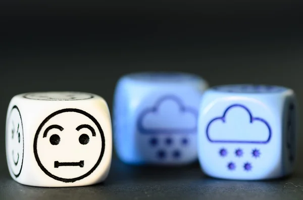 Concept of sad snow,  winter weather - emoticon and weather dice — Stock Photo, Image