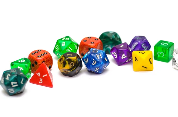 Multiple colorful role playing dices lying on isolated background — Stock Photo, Image