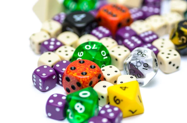 Multiple colorful role playing dices lying on isolated background — Stock Photo, Image