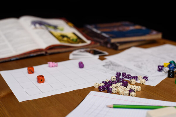 role playing game set up on table isolated on black background