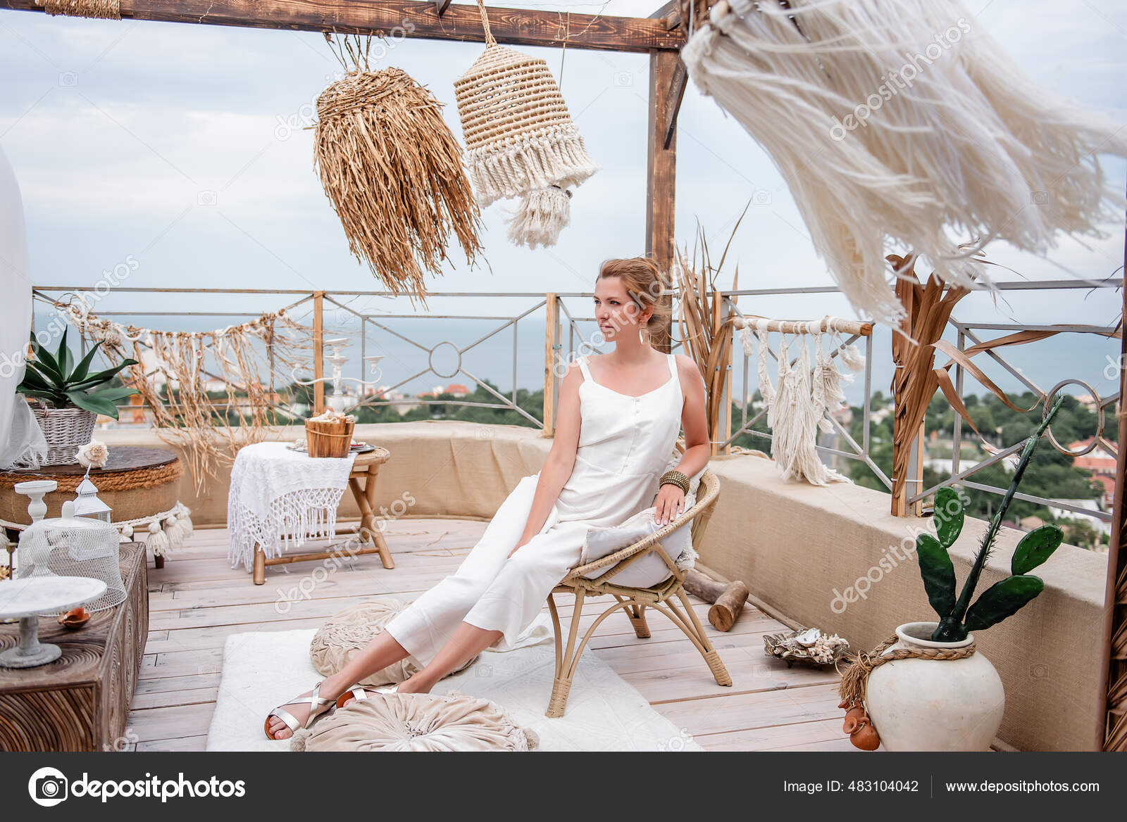 Young Woman Fashion White Jumpsuit Sits Vintage Vine Chair Outdoor Stock  Photo by ©farmuty.gmail.com 483104042