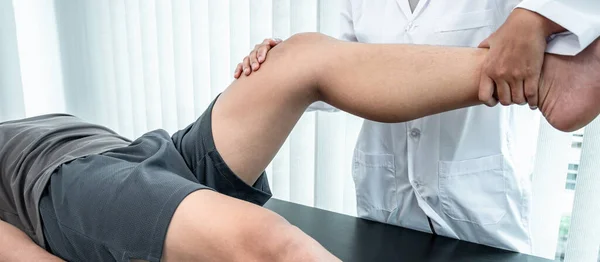 Physiotherapist Working Examining Treating Injured Leg Athlete Patient Doctor Doing — Stock Photo, Image