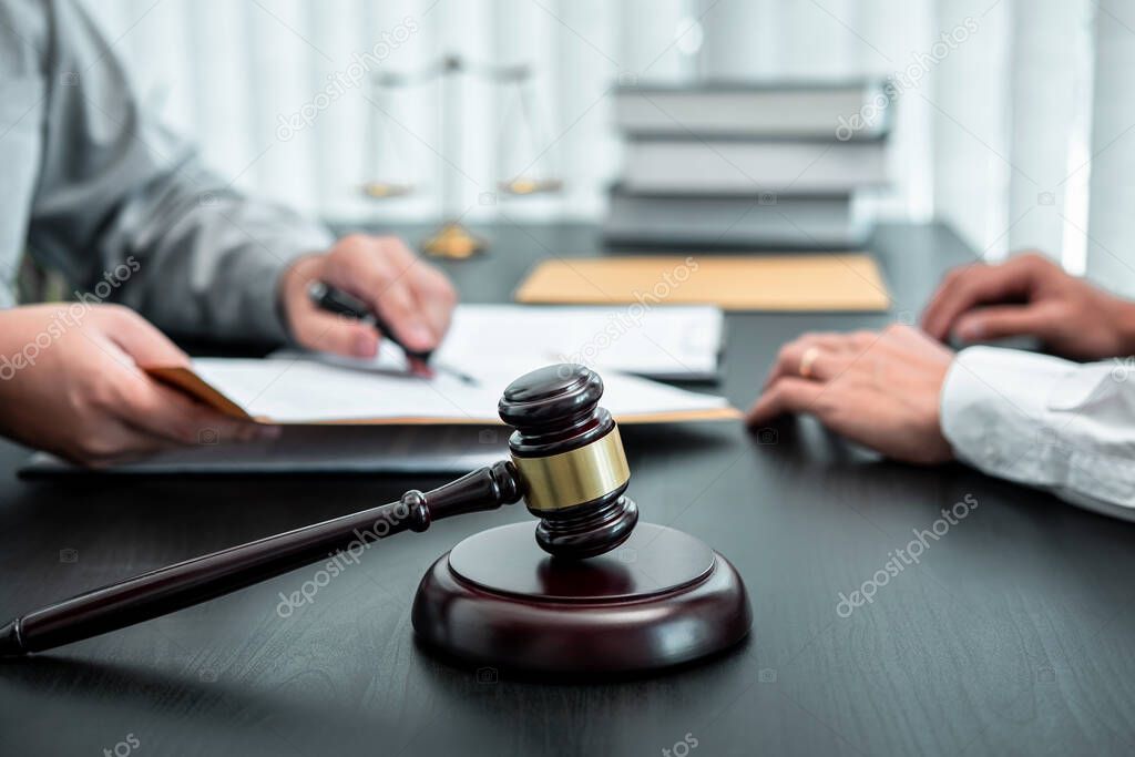Male lawyer discussing negotiation legal case with client meeting with document contract in office, law and justice, attorney, lawsuit concept.
