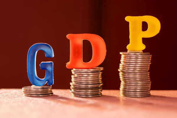 G D P colorful alphabets on coins showing upward trend