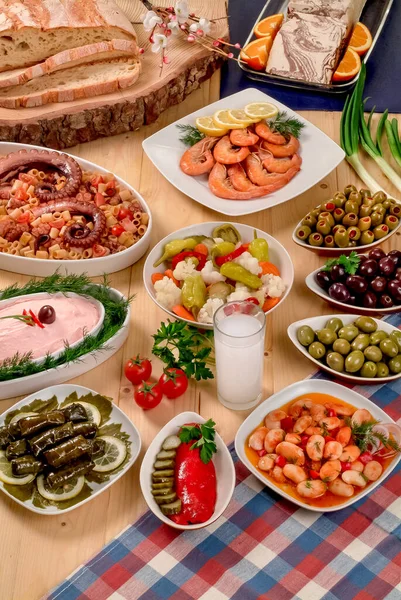 Greek traditional fasting food .Olives,beans,seafoods,traditional salads, bread and a glass of ouzo.