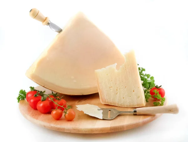 Block of cheese and slices on wooden board ,clipping path.