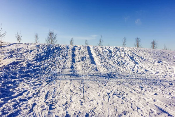 In winter, roller skates with tracks in the park