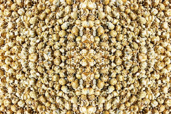 Texture background Blown corn with caramel glaze, top view