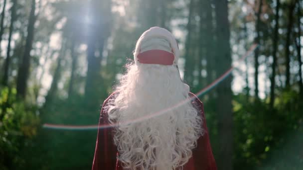 Funny Santa Claus with two medical masks on face walks Christmas coronavirus — Stock Video