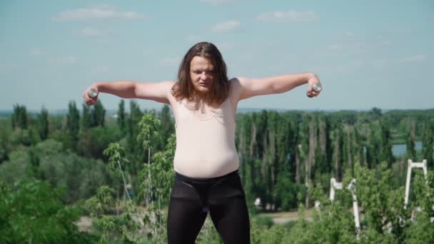 Playful Fat Man Long Hair Does Gymnastics Weight Loss Outdoors — Stock Video