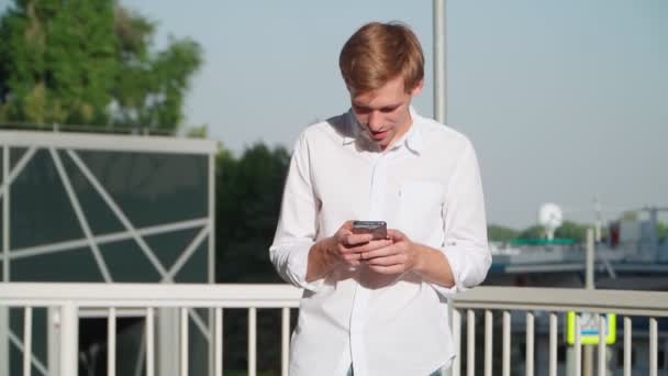 Handsome Young Man White Shirt Walking Using Mobile Phone Finds — Stock Video