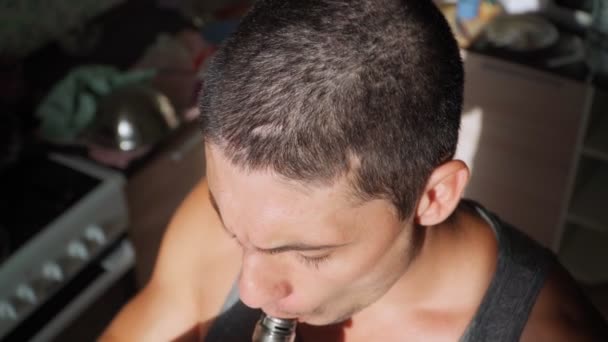 Young Guy Smokes Electronic Cigarette Home Man Uses Vape Bad — Stock Video