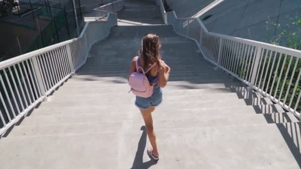 Happy Playful Woman Coming Stairs Backpack She Wearing Short Shorts — Stock Video