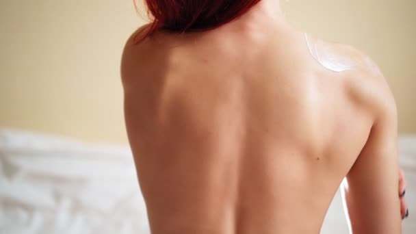 View from Back Slim Woman Applying Moisturizer Cream Body Lotion on Her Shoulder — Stock Video