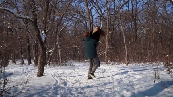 Happy Couple Funny Played in Winter Forest. Cheerful Man and Woman Have Fun Walk — Stock Video