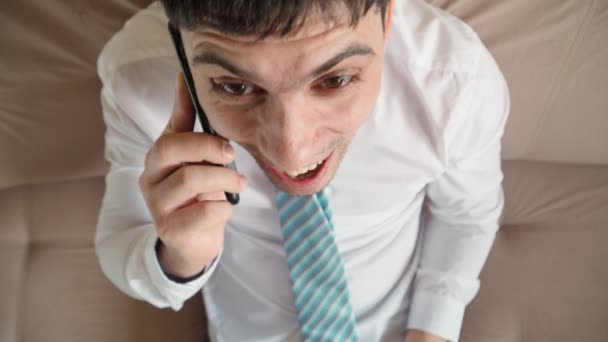 Emotions joy winner man talking on mobile phone. Office guy learned good news — Stock Video