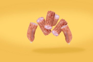 Bavarian hunting sausages floating in the air. Pieces of Bavarian hunting sausage