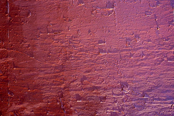 Roughly painted wall with dark red paint. Evidence of red paint. Beautiful Abstract Grunge Decorative Navy red Dark Wall Background. Art Rough Stylized Texture Banner With Space For Text