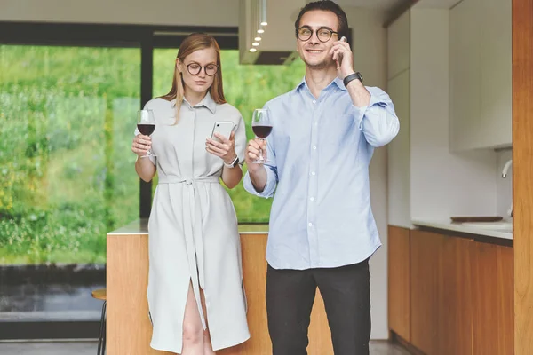 Successful couple of business celebrating on the kitchen