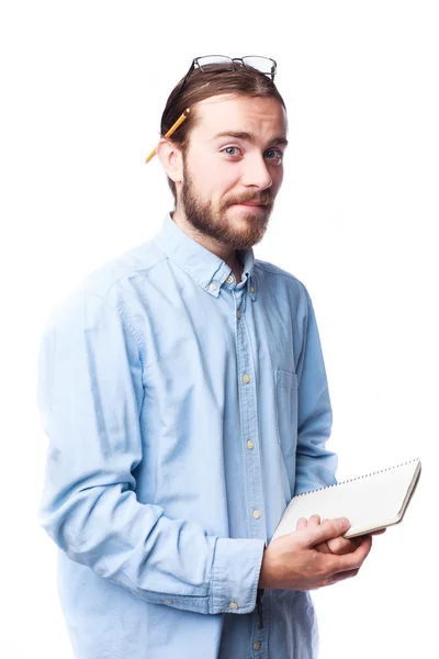 Bearded man holding notepad — Stock Photo, Image