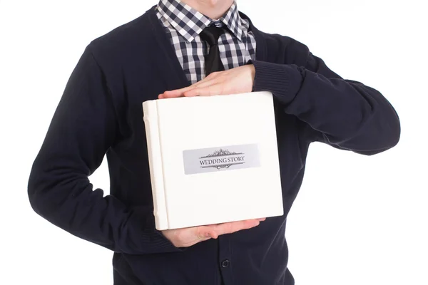 Handsome man holding a photobook — Stock Photo, Image