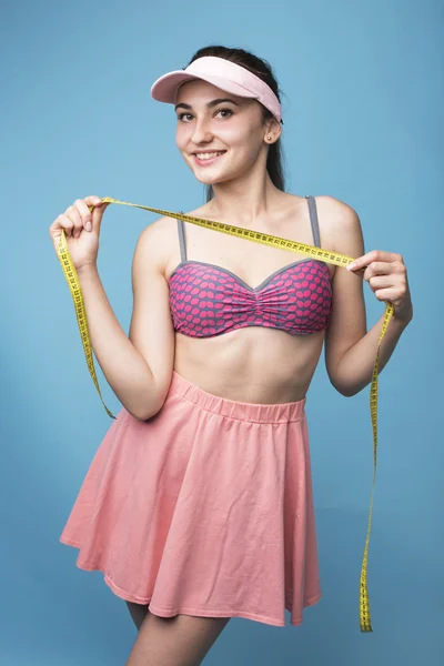 Young girl with tape to measure — Stock Photo, Image