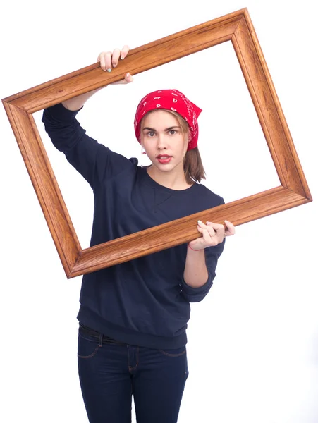Chica sosteniendo marco de imagen — Foto de Stock