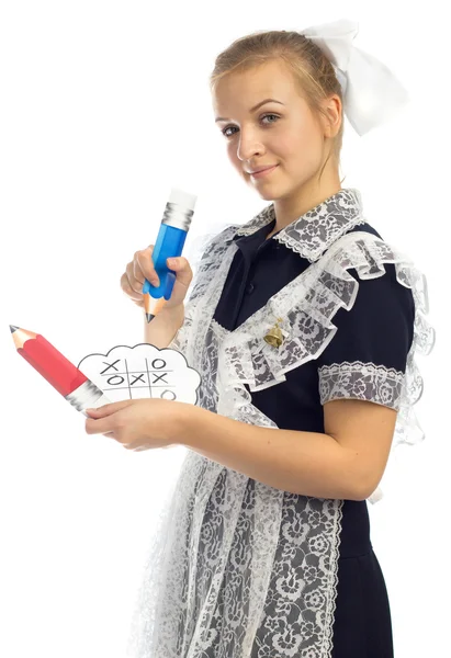 Schoolgirl plays tic-tac-toe — Stock Photo, Image