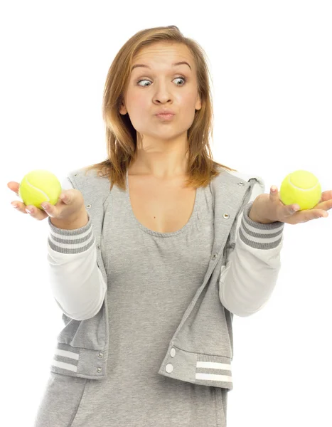 Mädchen hält Tennisbälle in der Hand — Stockfoto