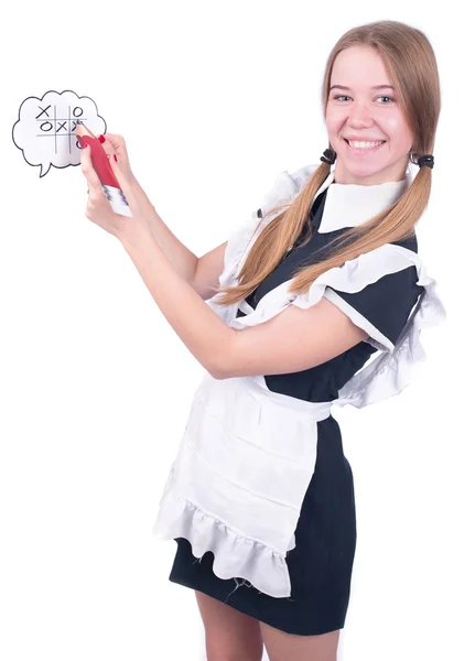 Beautiful schoolgirl plays tic-tac-toe — Stock Photo, Image