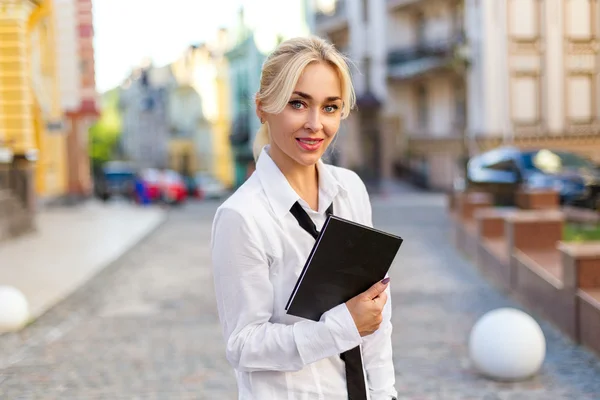 Beautiful business woman with book outdoor — Stock Photo, Image