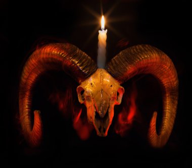 Skull of ram with lighted candle - Taro clipart