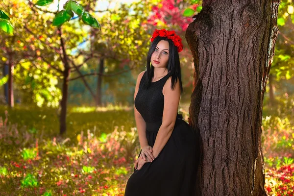 Gothic woman at the colorfull nature background — Stock Photo, Image
