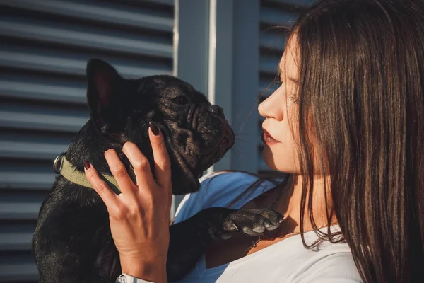 Portrait of black bulldog and its owner — Stock Photo, Image