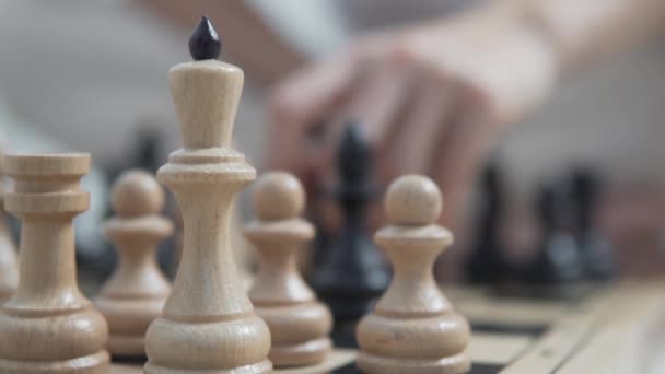 A close-up of a chessboard with figures. In the back — Stock Video