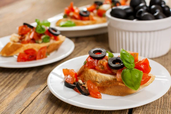 Bruschetta and olives — Stock Photo, Image