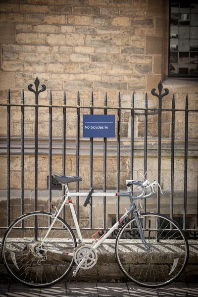 Bicycle Parked in front of building warning parking not allowed