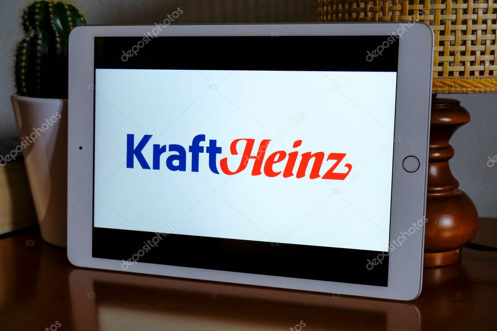 May 2021 Milan, Italy: Kraft Heinz company logo icon close-up on tablet screen in office. Kraft Heinz illustrative brand