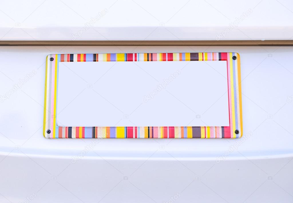 number plate of car with rainbow color frame