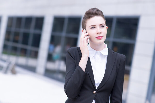 Modern business woman talking on phone